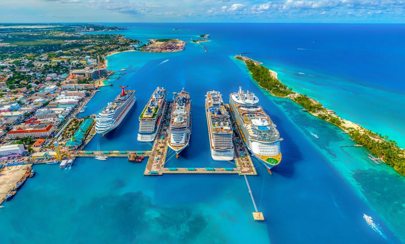 Cruise ships at a tropical international port surrounded by turquoise water